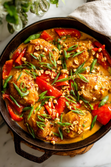 Thai Peanut Skillet Chicken recipe with flavorful chicken and colorful vegetables in creamy sauce, ideal for quick meals.